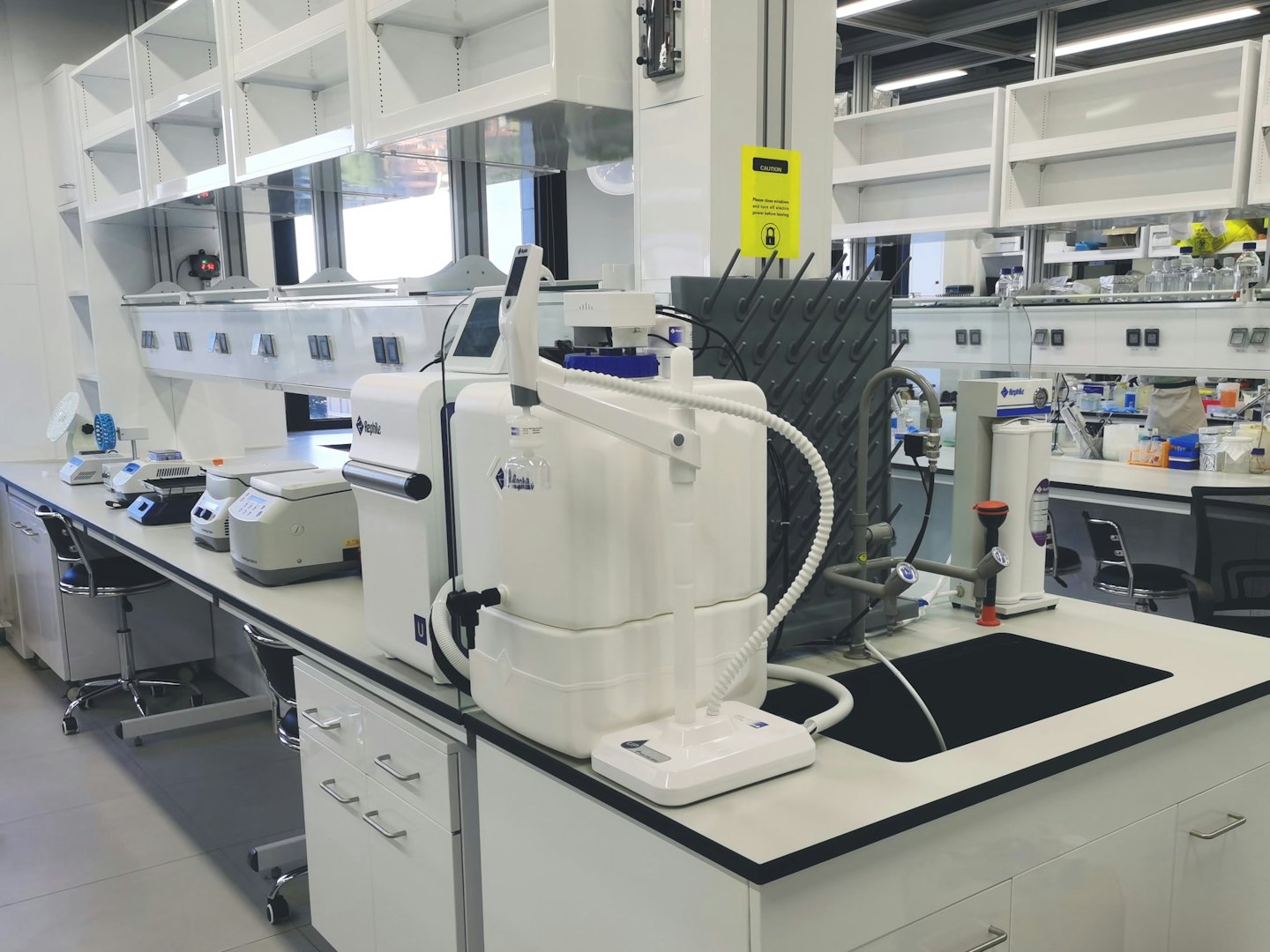 Scientific laboratory equipment on a white counter.