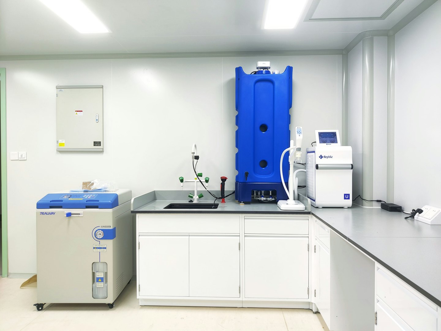Modern laboratory equipment with autoclave and liquid nitrogen tank.